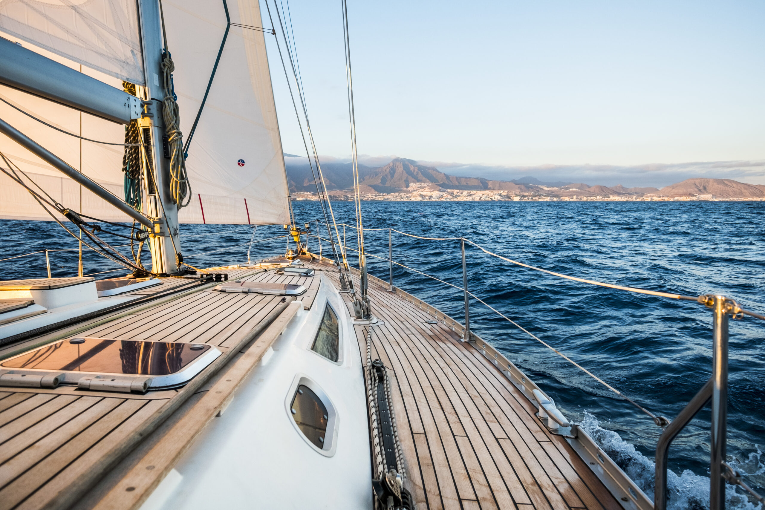 Sailboat and coastline in background - concept of travel and enj